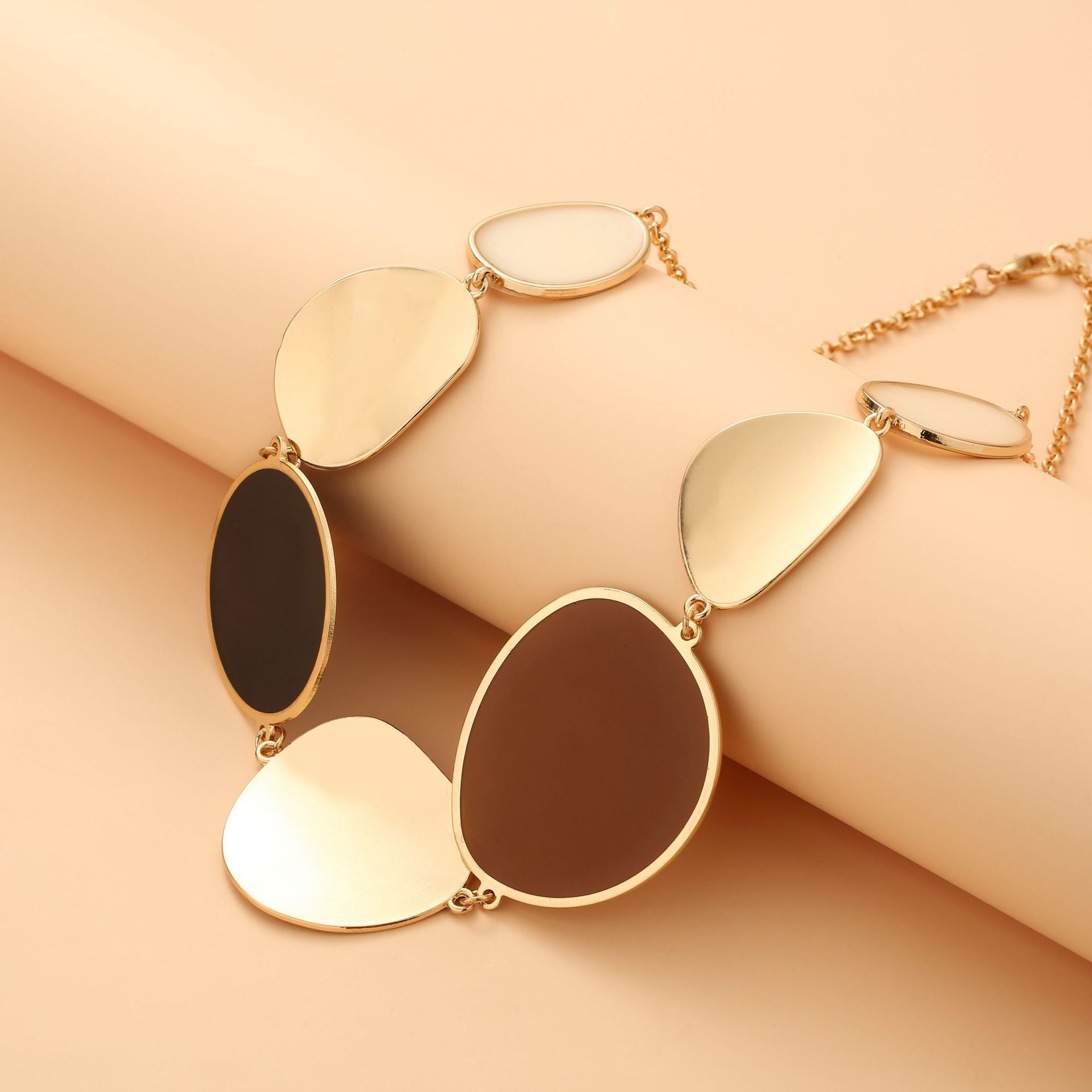 Stylish geometric necklace with irregular lenses